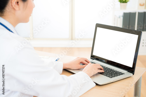 pretty elegant woman doctor using mobile laptop