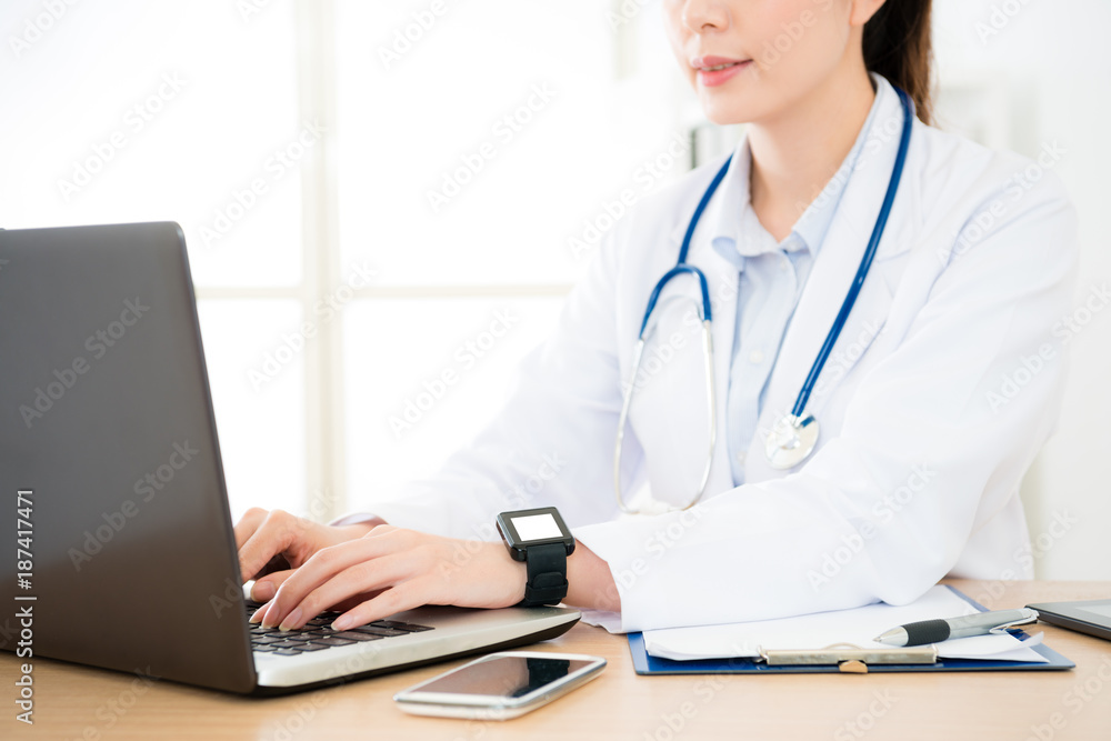 professional female doctor using mobile computer professional female doctor using mobile computer