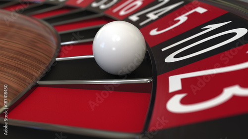 Fotografie Casino roulette wheel ball hits 10 ten black. 3D rendering