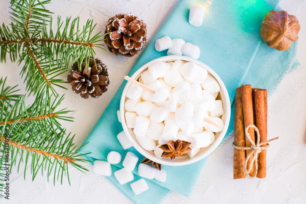 Marshmallow in a bowl and stick of cinnamon on a table. Top view Marshmallow in a bowl and stick of cinnamon on a table. Top view