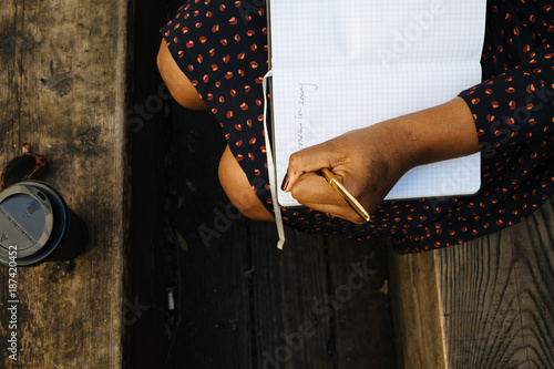 Woman writing in notebook