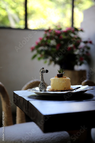 Cheese cake with blueberry jam sauce sweet food on wood background