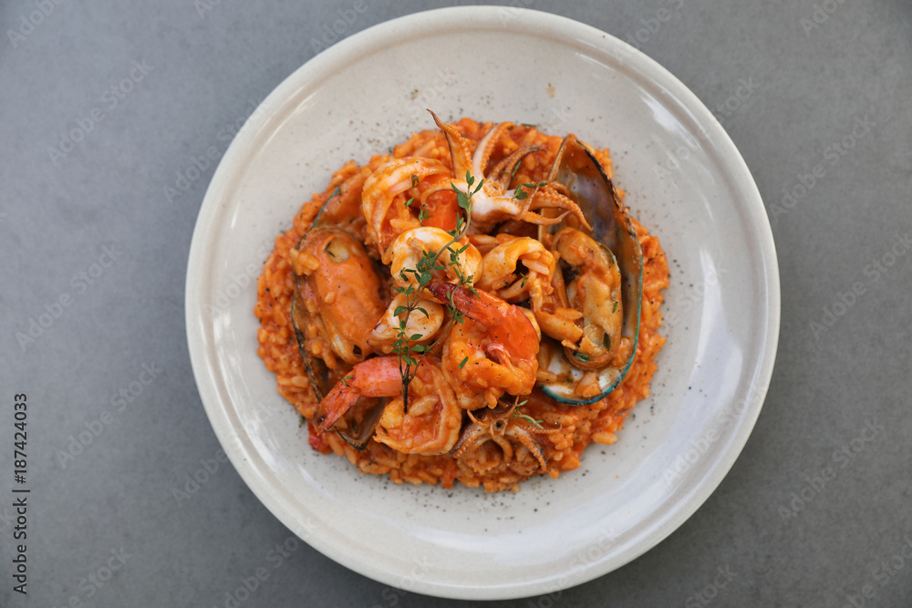 seafood risotto with mussel shrimp and squid , italian food seafood risotto with mussel shrimp and squid , italian food