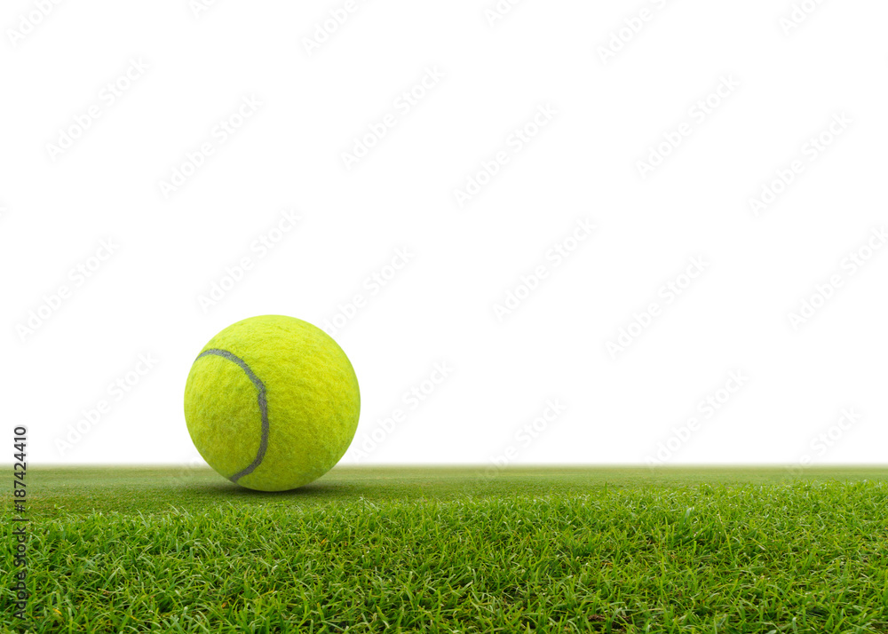 Single tennis ball on green grass isolated on white background.with space for text.