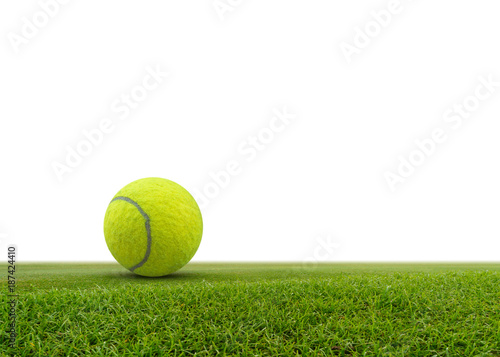 Single tennis ball on green grass isolated on white background.with space for text. © sarapon