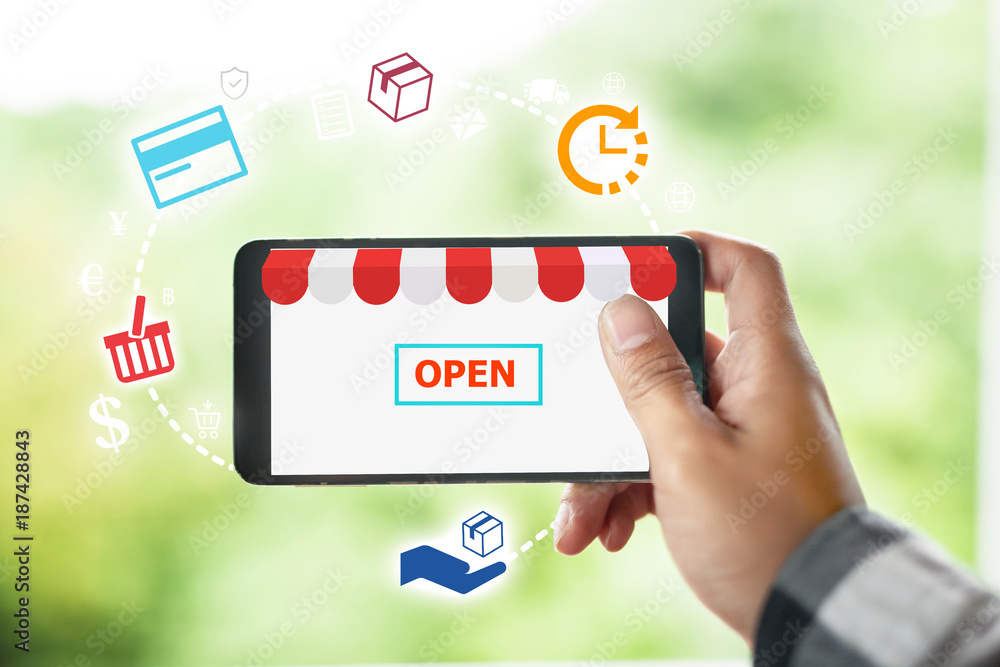 E-Commerce and online shopping, Online Shop Open concept with Hand holding tablet with icon in balloon isolated white background E-Commerce and online shopping, Online Shop Open concept with Hand holding tablet with icon in balloon isolated white background