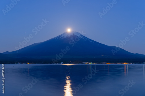 Pearl Fuji , Full moon overlaps the  Top of Mt. Fuji at Lake Yamanakako in spring morning © torsakarin