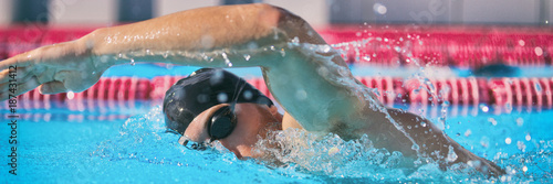 фотографія SPORTS and FITNESS concept sport athlete swimming in pool training cardio doing freestyle crawl technique for speed competition