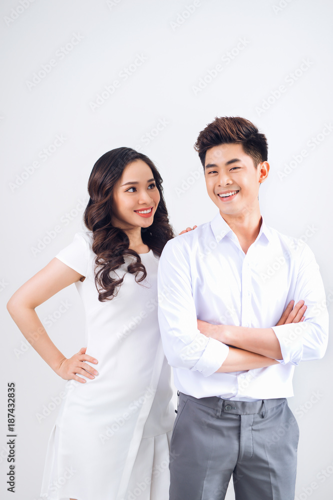 Happy together. Young in love couple smiling and standing against background Happy together. Young in love couple smiling and standing against background