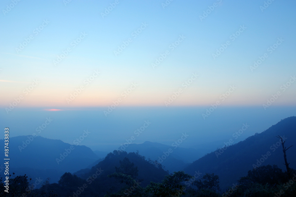 top hills and sunrise. Composition of the nature at Doi ang khang, Chiangmai Thailand , background