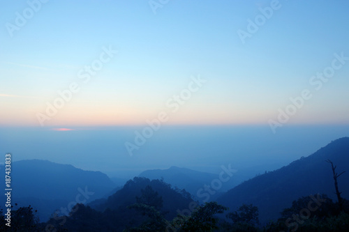 top hills and sunrise. Composition of the nature at Doi ang khang, Chiangmai Thailand , background