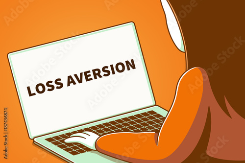 Billede på lærred Woman looking at a laptop screen with the words loss aversion