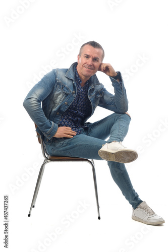 man sitting on a chair with white background