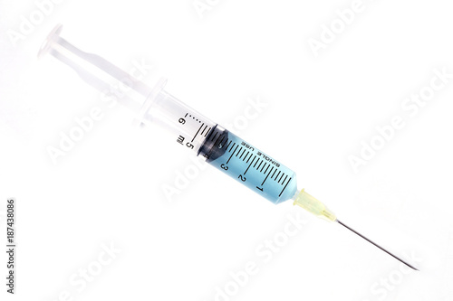 Syringe closeup with blue serum isolated on white background.
