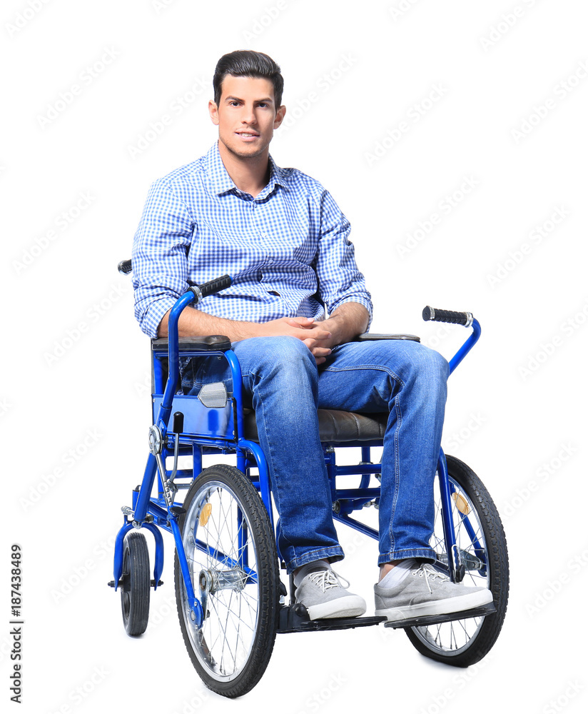 Attractive young man in wheelchair on white background Attractive young man in wheelchair on white background