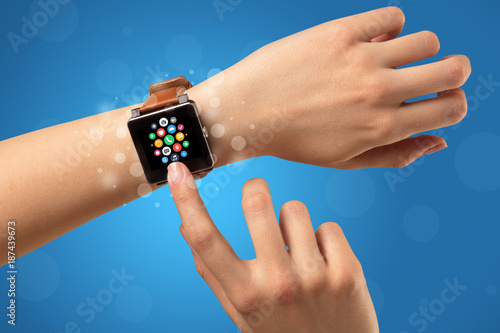 Female hand with smartwatch and app icons
