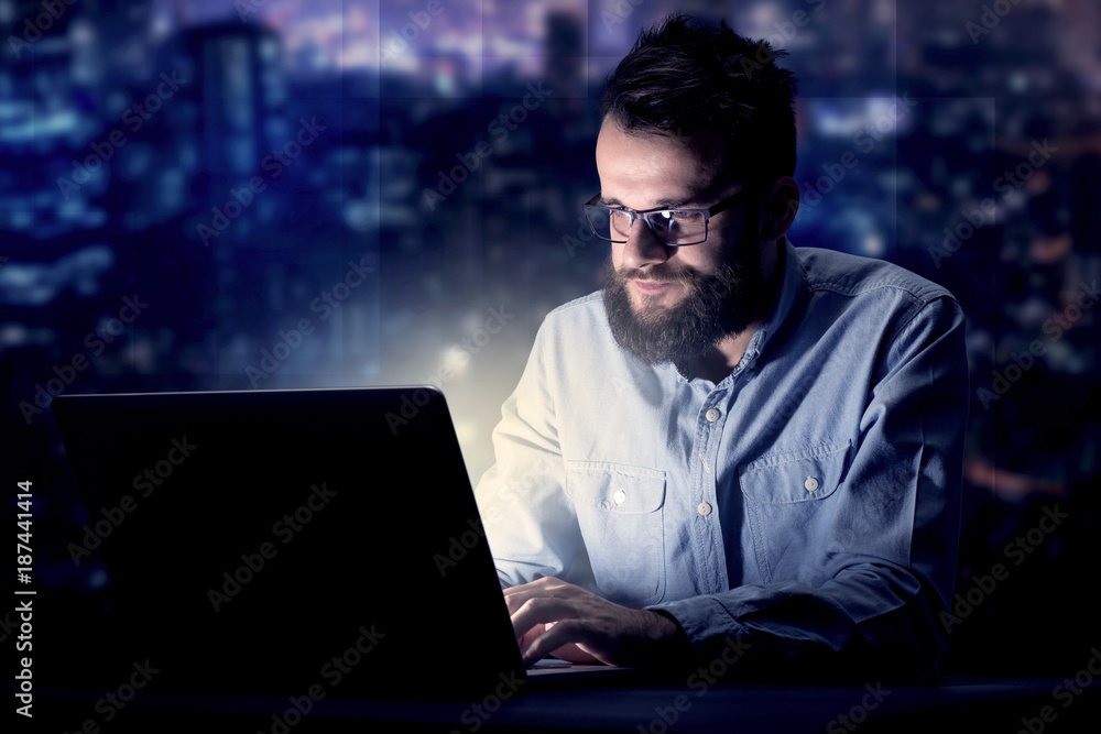Businessman in the office at night Businessman in the office at night