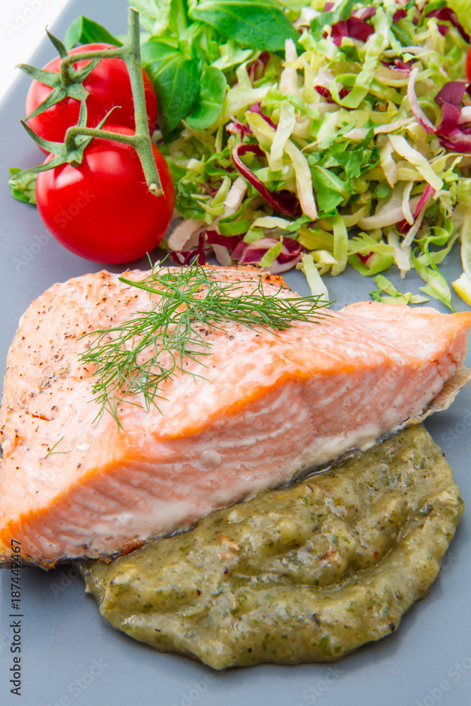 salmon fillet with sauce and mixed salad salmon fillet with sauce and mixed salad