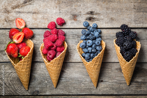 Selection of summer berries in ice cream cones