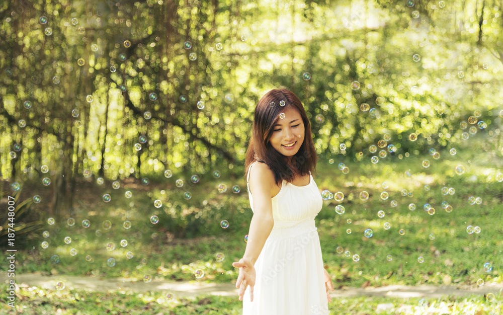 adorable cute girl blowing bubbles in the park adorable cute girl blowing bubbles in the park
