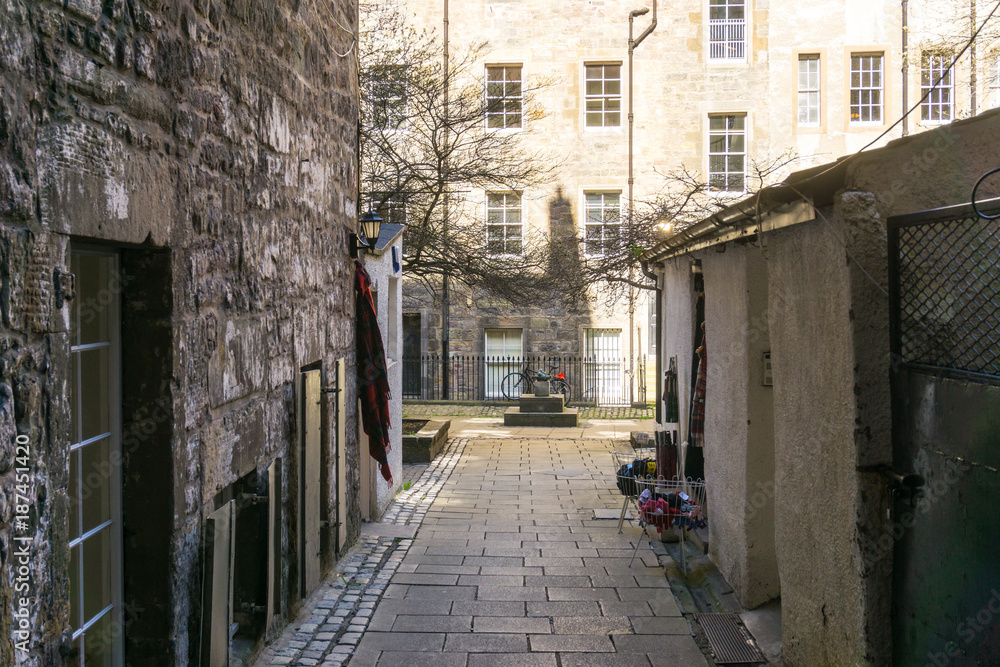 EDINBURGH, SCOTLAND - March 27, 2017: Street view of Historic Old Town Houses in Edinburgh, Scotland EDINBURGH, SCOTLAND - March 27, 2017: Street view of Historic Old Town Houses in Edinburgh, Scotland