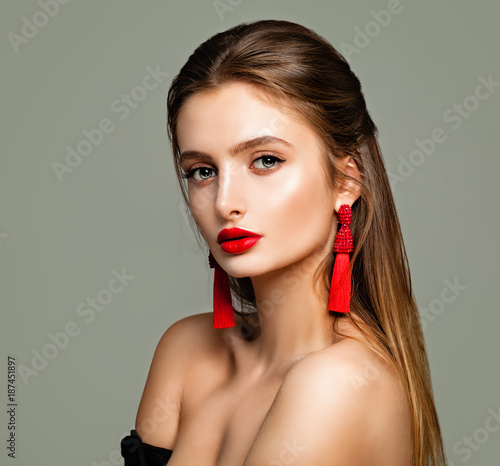 Pretty Young Model with Makeup, Long Brown Hair and Jewelry Earrings. Beautiful Model, Cute Female Face