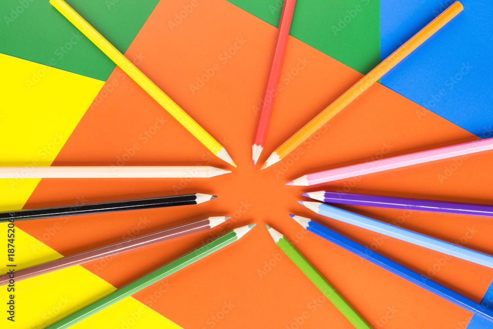 Fototapeta premium Colorful pencils on the paper background.