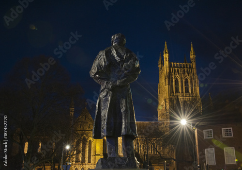 Elgar statue at night with Worcester cathedral