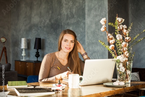 Creative Designer Woman Using Laptop and Graphics Tablet at Office Deck