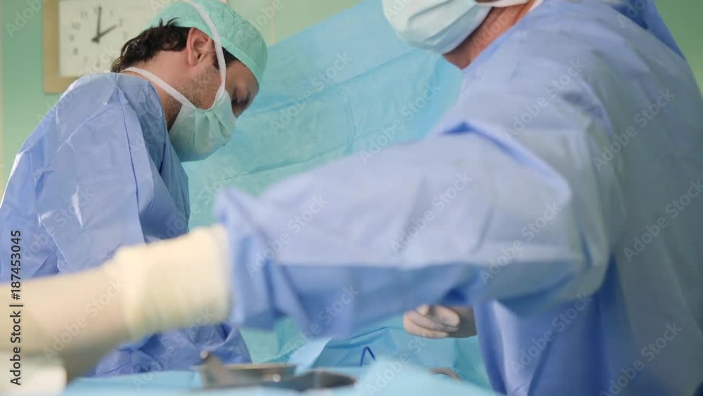 Real surgery team in the operating room. Live session of breast augmentation surgery. 4K slow motion video. Real surgery team in the operating room. Live session of breast augmentation surgery. 4K slow motion video.