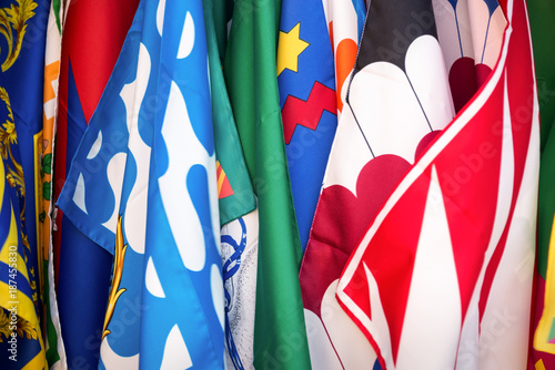 Flags of the Siena contrade (districts), Palio festival background, in Siena, Tuscany, Italy photo