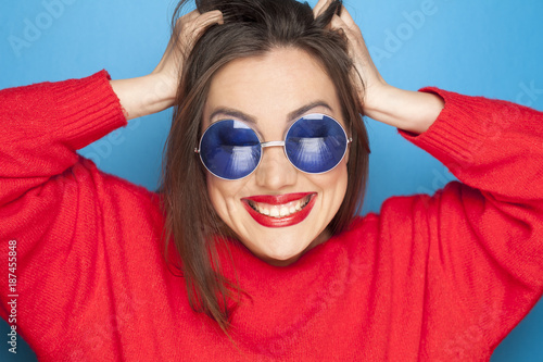 beautiful happy woman with blue sunglasses