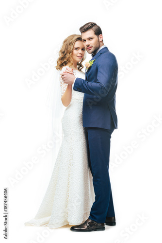 young bride and groom dancing together isolated on white Fototapeta