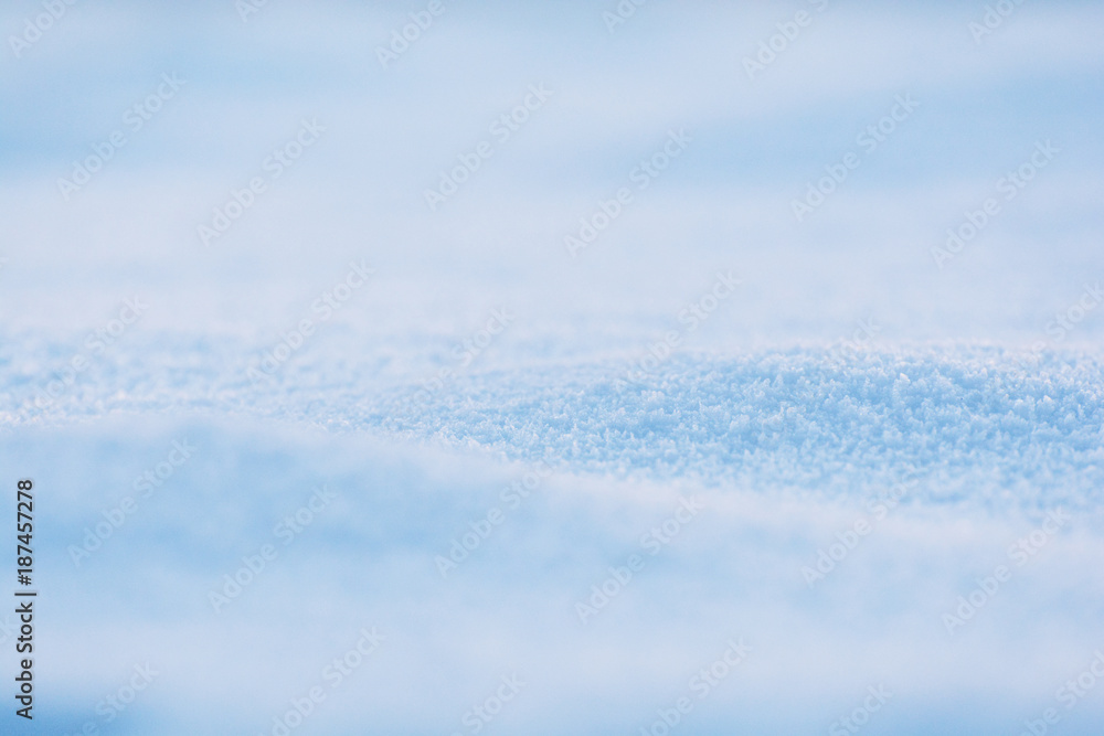 Blue white snowy blurred background