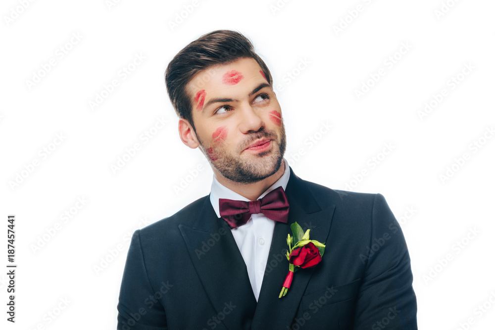 portrait of handsome groom in suit with red lipstick on face isolated on white portrait of handsome groom in suit with red lipstick on face isolated on white