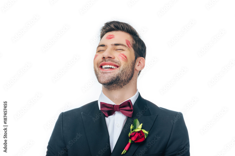 portrait of handsome happy groom in suit with red lipstick on face isolated on white portrait of handsome happy groom in suit with red lipstick on face isolated on white