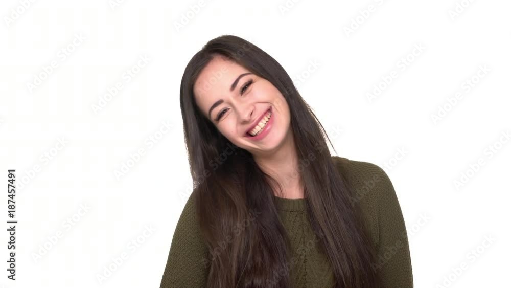 Studio portrait of joyous lady fooling around having fun with sticking her tongue out and protruding ears over white background closeup. Concept of emotions Studio portrait of joyous lady fooling around having fun with sticking her tongue out and protruding ears over white background closeup. Concept of emotions