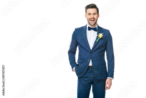 portrait of young handsome groom in suit isolated on white