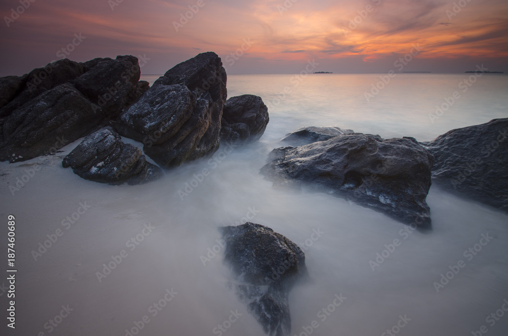 Obraz premium Sunset at Ujung gelam beach, karimun jawa island, central java, indonesia