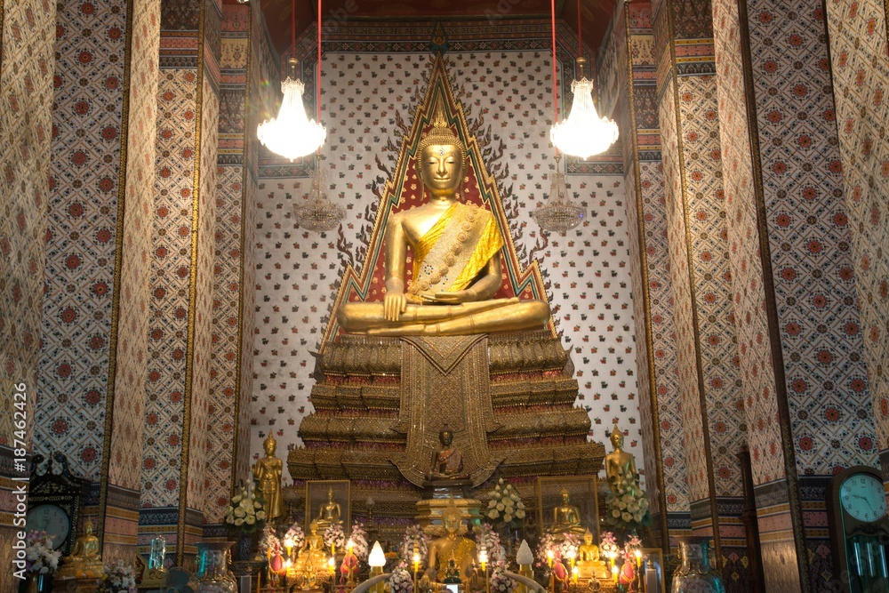 Golden sitting Main Buddha at main Prang of Wat Arun Ratchawararam temple ,Bangkok,Thailand.