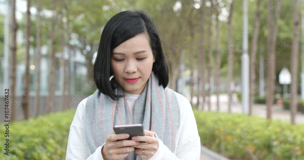Woman using cellphone at outdoor Woman using cellphone at outdoor
