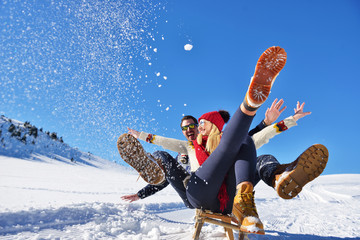 romantic winter scene, happy young couple having fun on fresh show on winter vacatio, mountain nature landscape