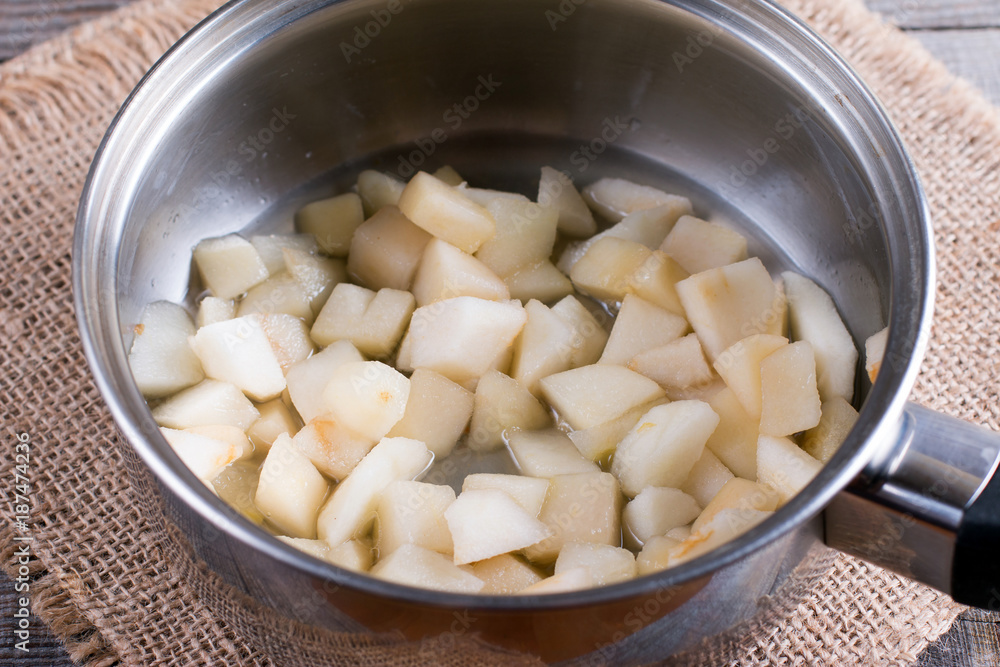 Pieces of pear in a saucepan. Preparing children's puree Pieces of pear in a saucepan. Preparing children's puree