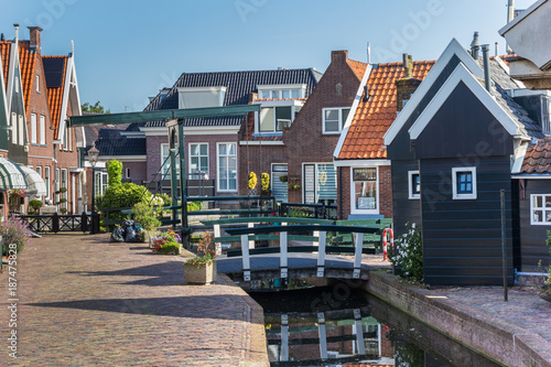 Little canal and historic houses in he center of Volendam photo