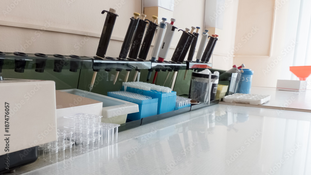 Table with medical laboratory instruments for analysis of blood samples ...