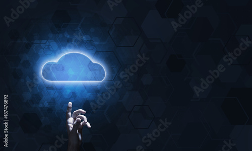 Technology idea concept with glowing cloud icon and touching it finger