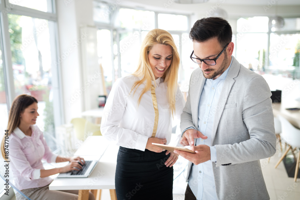 Image of two successful business partners working at meeting Image of two successful business partners working at meeting