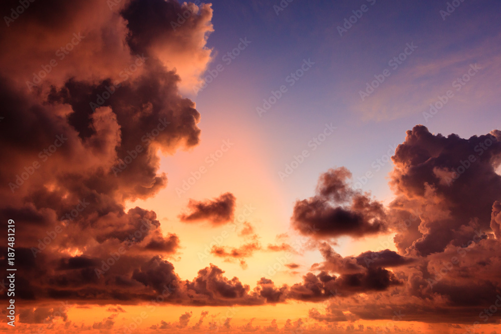 Red sky with sun red light reflexted in the warm cloud color background.
