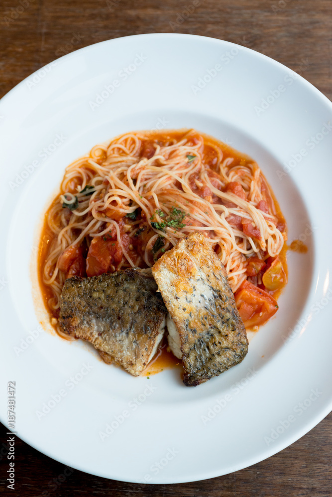 Grilled sea bass and spaghetti with tomato sauce Grilled sea bass and spaghetti with tomato sauce