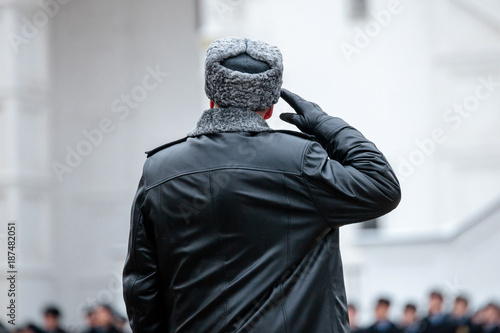 Russian army general. Salutation. Back view. Winter view.